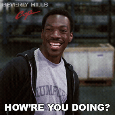 A Poster For Beverly Hills Cop Shows A Smiling Man GIF