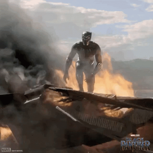 A Poster For Black Panther Shows A Man In A Superhero Costume GIF