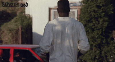 A Poster For Boyz In The Hood Shows A Man Standing In Front Of A Car GIF