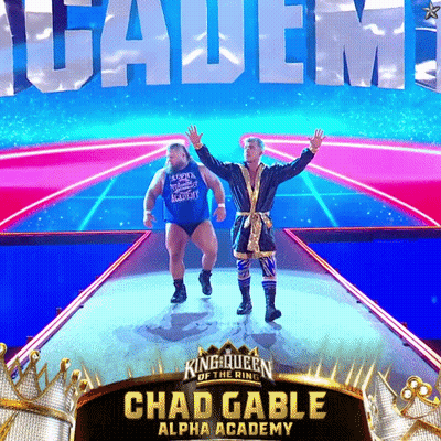 A Poster For Chad Gable Alpha Academy With Two Men On Stage GIF