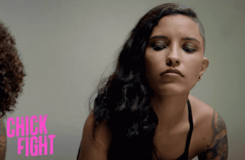 A Poster For Chick Fight Shows A Woman In A Black Top GIF