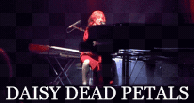 A Poster For Daisy Dead Petals Shows A Woman Playing A Keyboard GIF