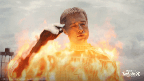 A Poster For Fantastic Four Shows A Man Covered In Flames GIF