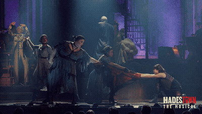 A Poster For Hadestown The Musical Shows A Group Of People Dancing On A Stage GIF