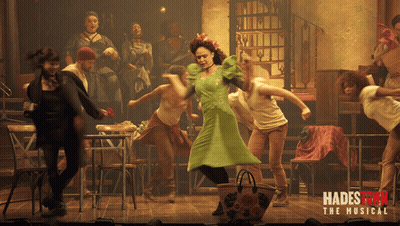 A Poster For Hadestown The Musical Shows A Group Of People Dancing On Stage GIF