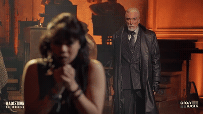 A Poster For Hadestown The Musical Shows A Man And Woman Singing GIF