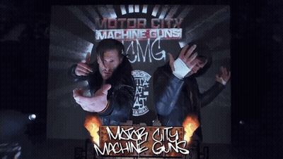 A Poster For Motor City Machine Guns Shows Two Men On A Stage GIF