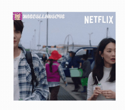 A Poster For Netflix Shows A Man And A Woman Walking GIF