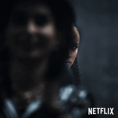 A Poster For Netflix Shows A Woman In A Black Jacket GIF