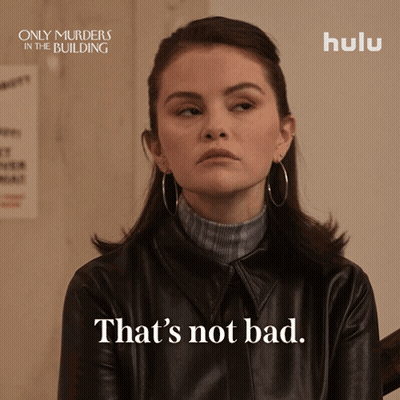 A Poster For Only Murders In The Building Shows A Woman Wearing A Leather Jacket GIF