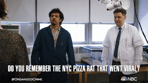 A Poster For Organized Crime Shows Two Men Standing Next To Each Other GIF