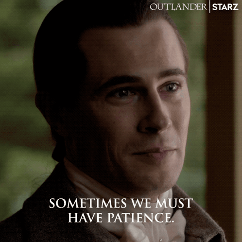 A Poster For Outlander Starz Shows A Man In A Suit And Tie GIF