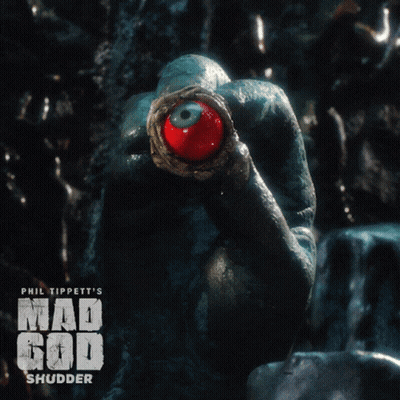 A Poster For Phil Tippett 'S Mad God Shudder Shows A Frog With A Red Eye GIF