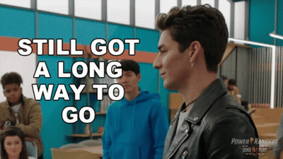A Poster For Power Rangers Shows A Man In A Black Jacket GIF