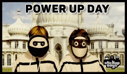 A Poster For Power Up Day With Two Masked Boys In Front Of A Building GIF