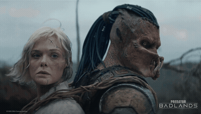 A Poster For Predator Badlands Features A Woman And A Monster GIF