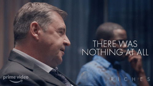 A Poster For Riches Shows A Man In A Suit And Tie Talking GIF