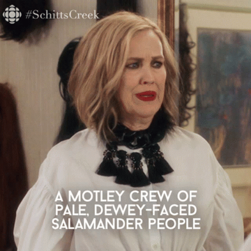 A Poster For Schitt 'S Creek Shows A Woman With Red Lipstick GIF