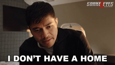 A Poster For Snake Eyes Shows A Man Looking At Something GIF