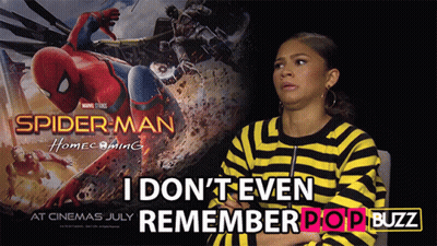 A Poster For Spider Man Homecoming Shows A Woman In A Yellow And Black Striped Shirt GIF