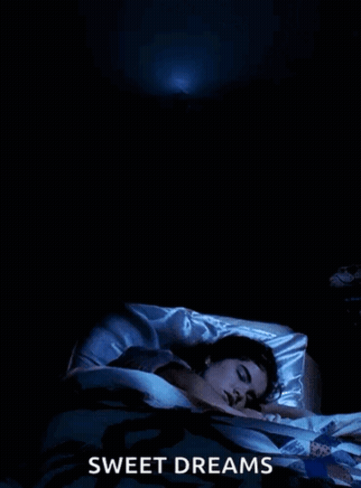A Poster For Sweet Dreams Shows A Woman Sleeping In A Bed GIF