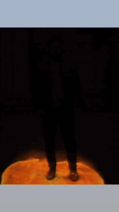 A Poster For Sweet Leaf Shows A Man Standing In Front Of A Fire GIF