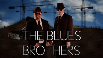 A Poster For The Blues Brothers With Two Men In Suits GIF