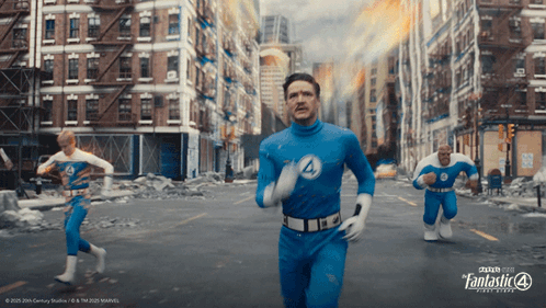 A Poster For The Fantastic Four Shows Three Men Running Through A City GIF