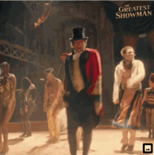A Poster For The Greatest Showman With A Man In A Top Hat GIF
