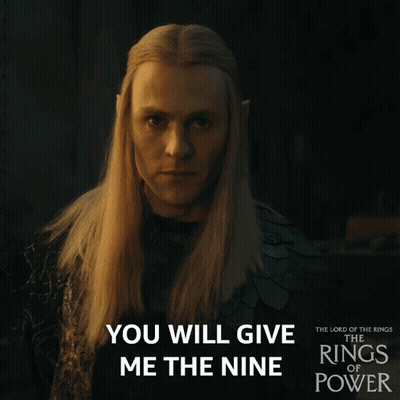A Poster For The Lord Of The Rings Of Power Shows A Man With Long Blonde Hair GIF