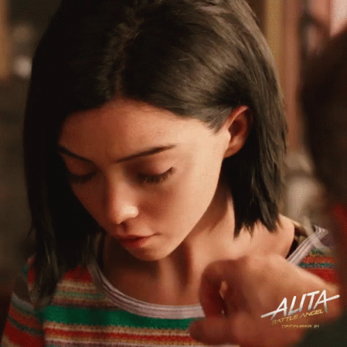 A Poster For The Movie Alita Shows A Girl Looking Down GIF