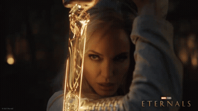 A Poster For The Movie Eternals Shows A Woman GIF
