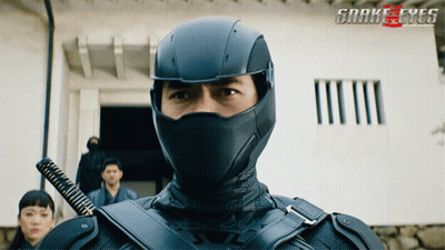 A Poster For The Movie Snake Eyes Shows A Man In A Black Mask GIF