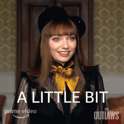 A Poster For The Outlaws Shows A Woman Wearing A Black Hat And A Black Top GIF