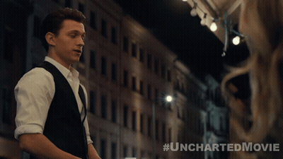 A Poster For The Uncharted Movie Shows A Man In A Suit And Vest GIF