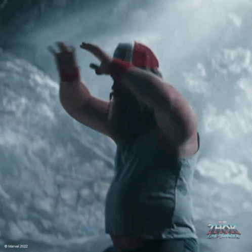 A Poster For Thor The Dark World Shows A Man In A Gray Shirt GIF