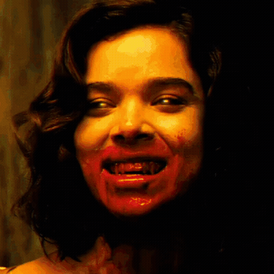 A Poster Of A Woman With Blood On Her Face And The Words Denims Factory Below Her GIF