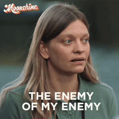 A Poster With A Woman And The Words The Enemy Of My Enemy On It GIF