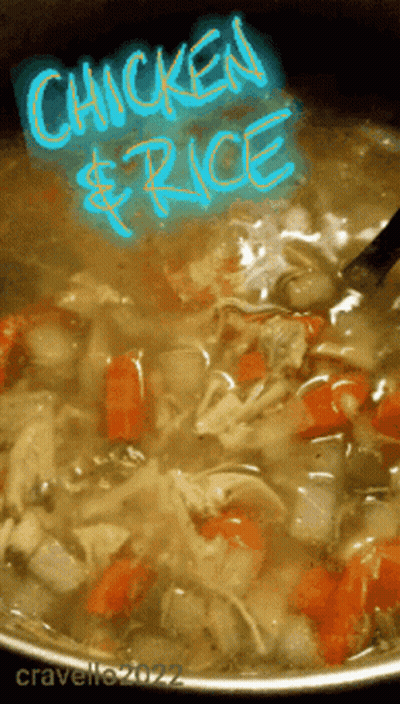 A Pot Of Chicken And Rice Soup With A Spoon GIF