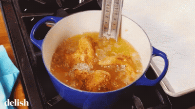 A Pot Of Food Is Being Cooked On A Stove And The Word Delish Is On The Bottom Right GIF