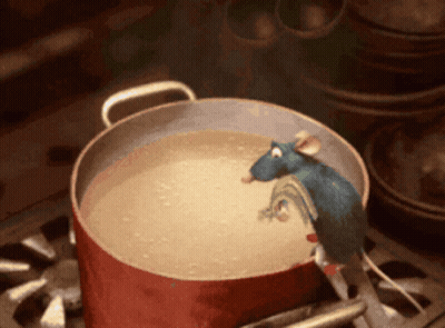 A Pot Of Soup With A Mouse Sticking Its Head Out Of It GIF