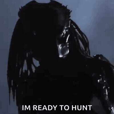 A Predator From The Movie Predator Is Ready To Hunt Someone . GIF