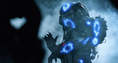 A Predator With Blue Lights Around His Body GIF