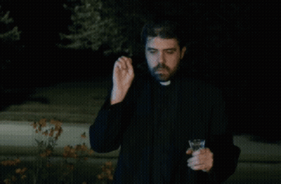 A Priest Is Holding A Wine Glass And Making A Funny Face GIF