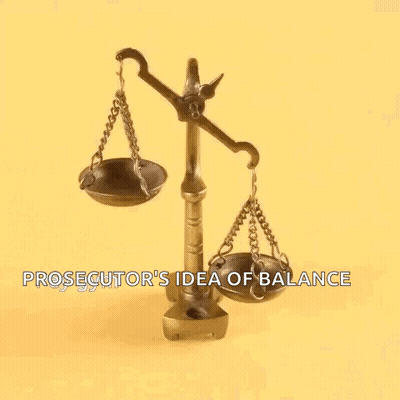 A Prosecutor 'S Idea Of Balance Is Shown With A Person 'S Finger On The Scales . GIF