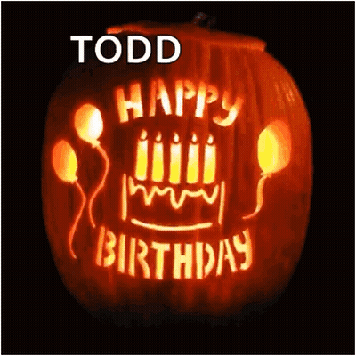 A Pumpkin With Candles And Balloons Carved Into It That Says Happy Birthday GIF