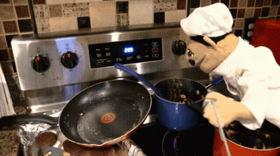 A Puppet Chef Is Cooking On A Stove With The Time 2:08 GIF