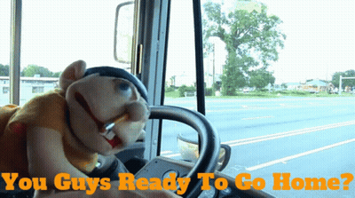 A Puppet Driving A Bus With The Words " You Guys Ready To Go Home " Below It GIF