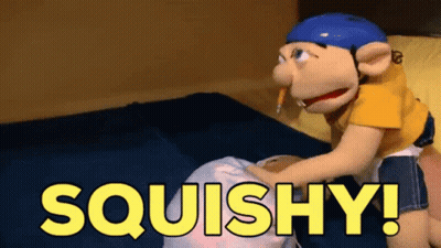 A Puppet Is Sitting On A Bed With The Words Squishy Written In Yellow GIF