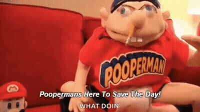 A Puppet Is Sitting On A Couch With A Pencil In His Mouth And A Red Shirt On . GIF